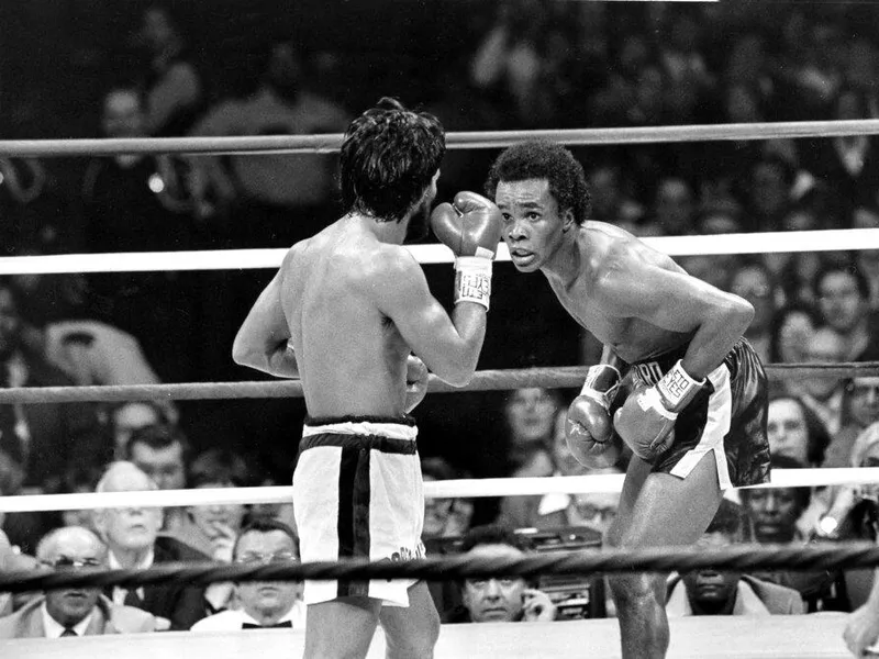 Sugar Ray Leonard, right