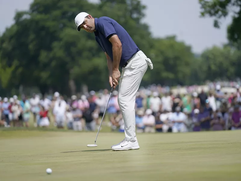 Scottie Scheffler putts at 2023 Charles Schwab Challenge in Fort Worth, Texas