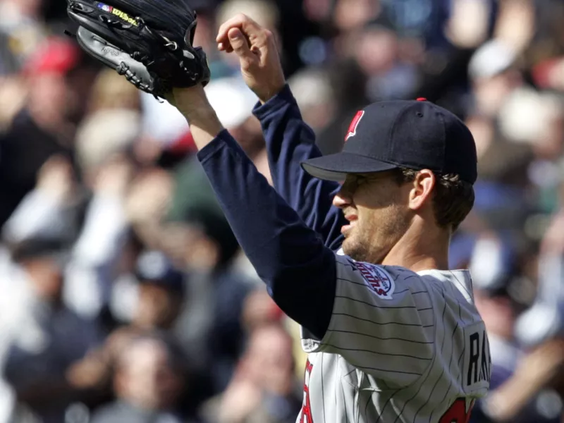Minnesota Twins starting pitcher Brad Radke throws up