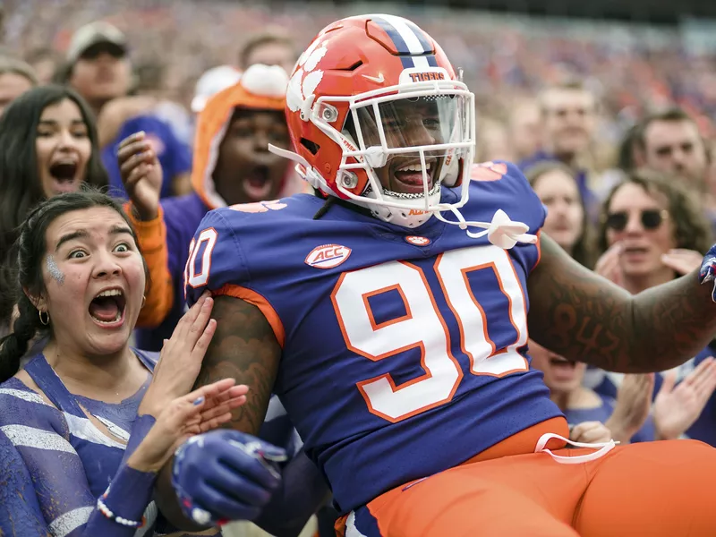 Clemson defensive tackle Jabriel Robinson celebrates with students