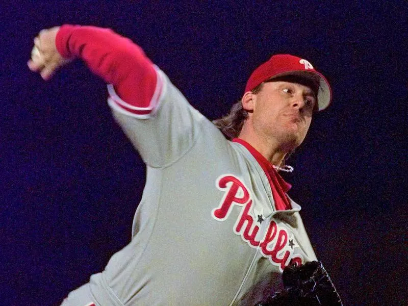 Curt Schilling throws to the plate