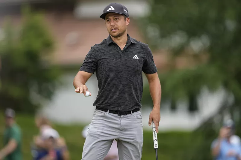 Xander Schauffele reacts to his birdie at 2023 Wells Fargo Championships golf tournament