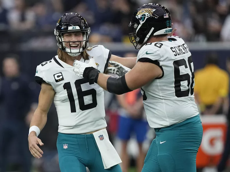 Jacksonville Jaguars quarterback Trevor Lawrence and guard Brandon Scherff